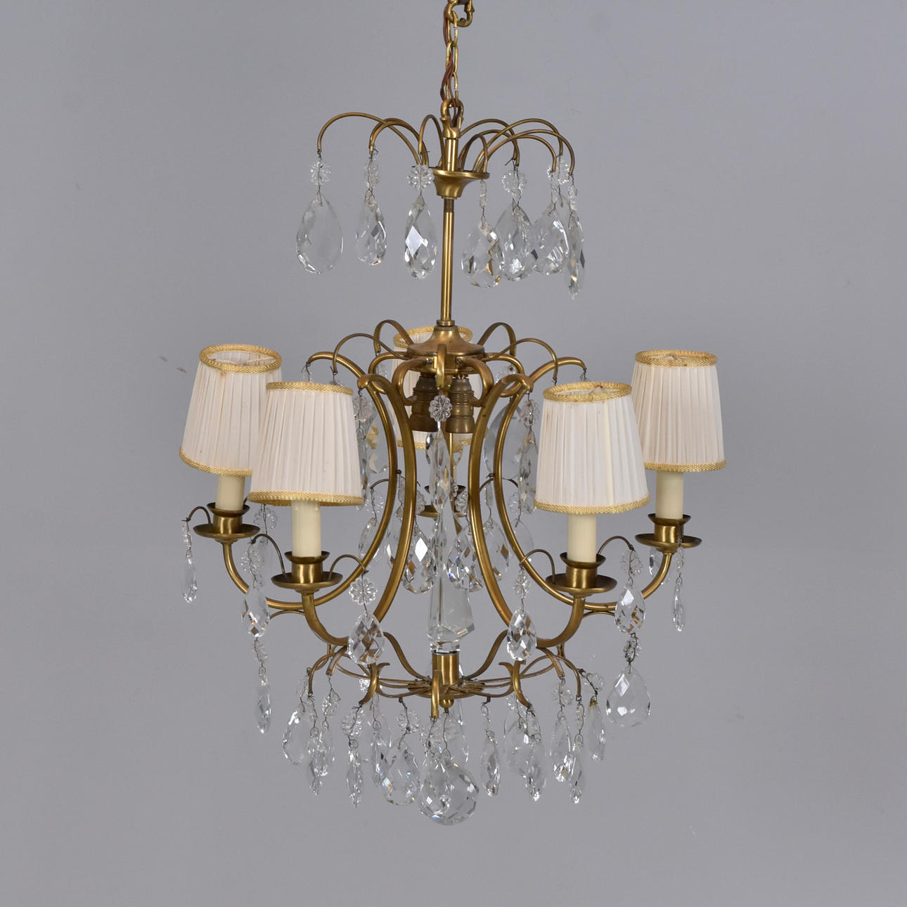 A brass ceiling chandelier with prisms, 20th century.