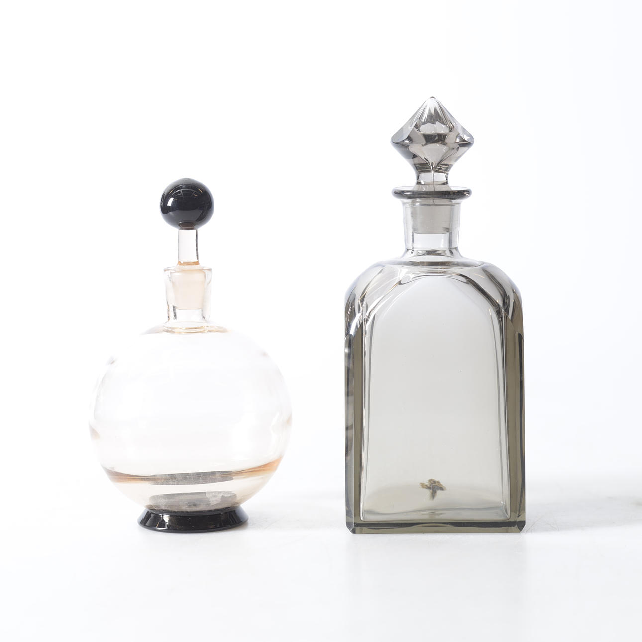 Two glass bottles with stopper, 20th century.