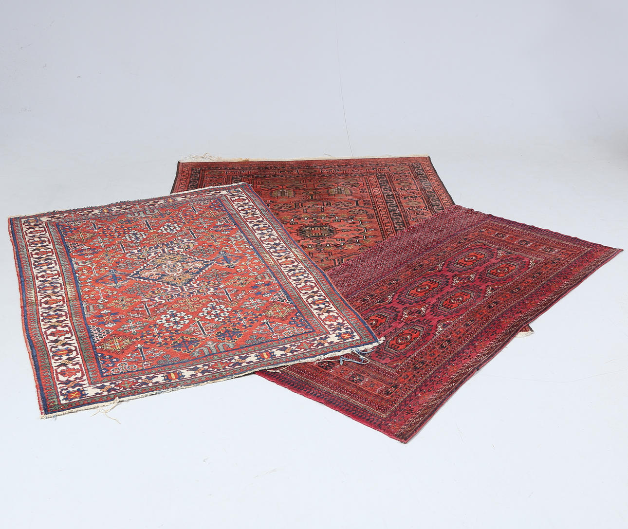 THREE ORIENTAL RUGS.