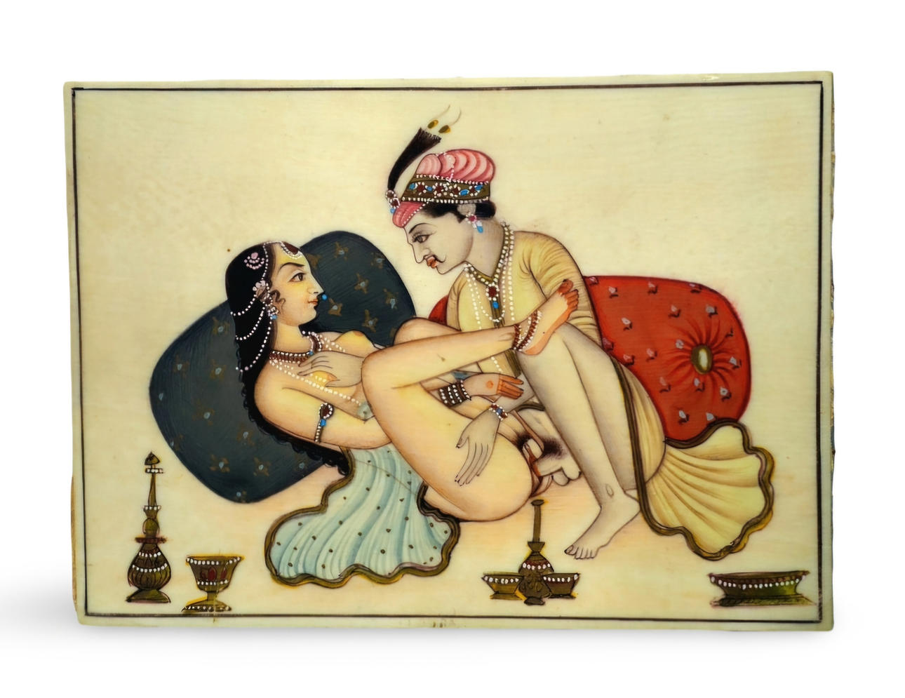 Erotic plate in carved bone.