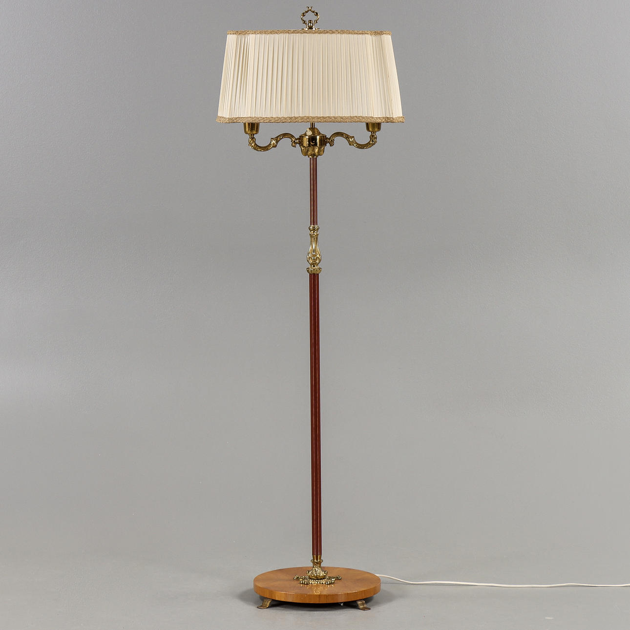 A brass floor lamp, mid 20th century.