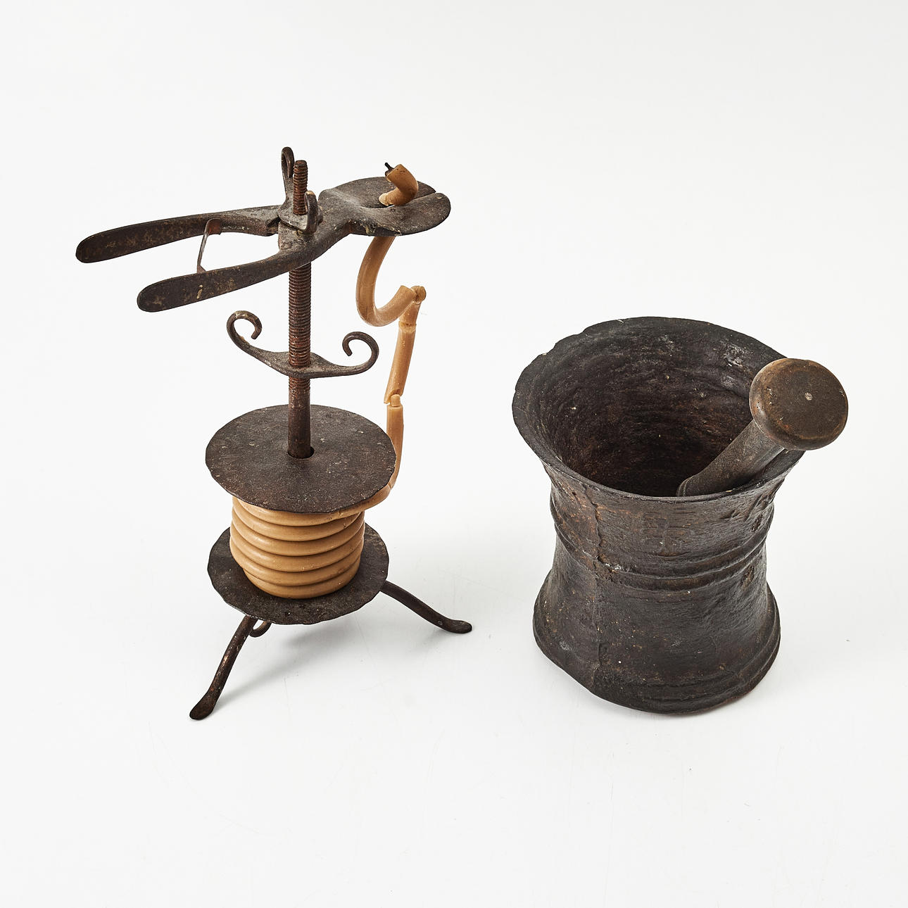 A MORTELL WAX STACK STAND, 19th century, iron.