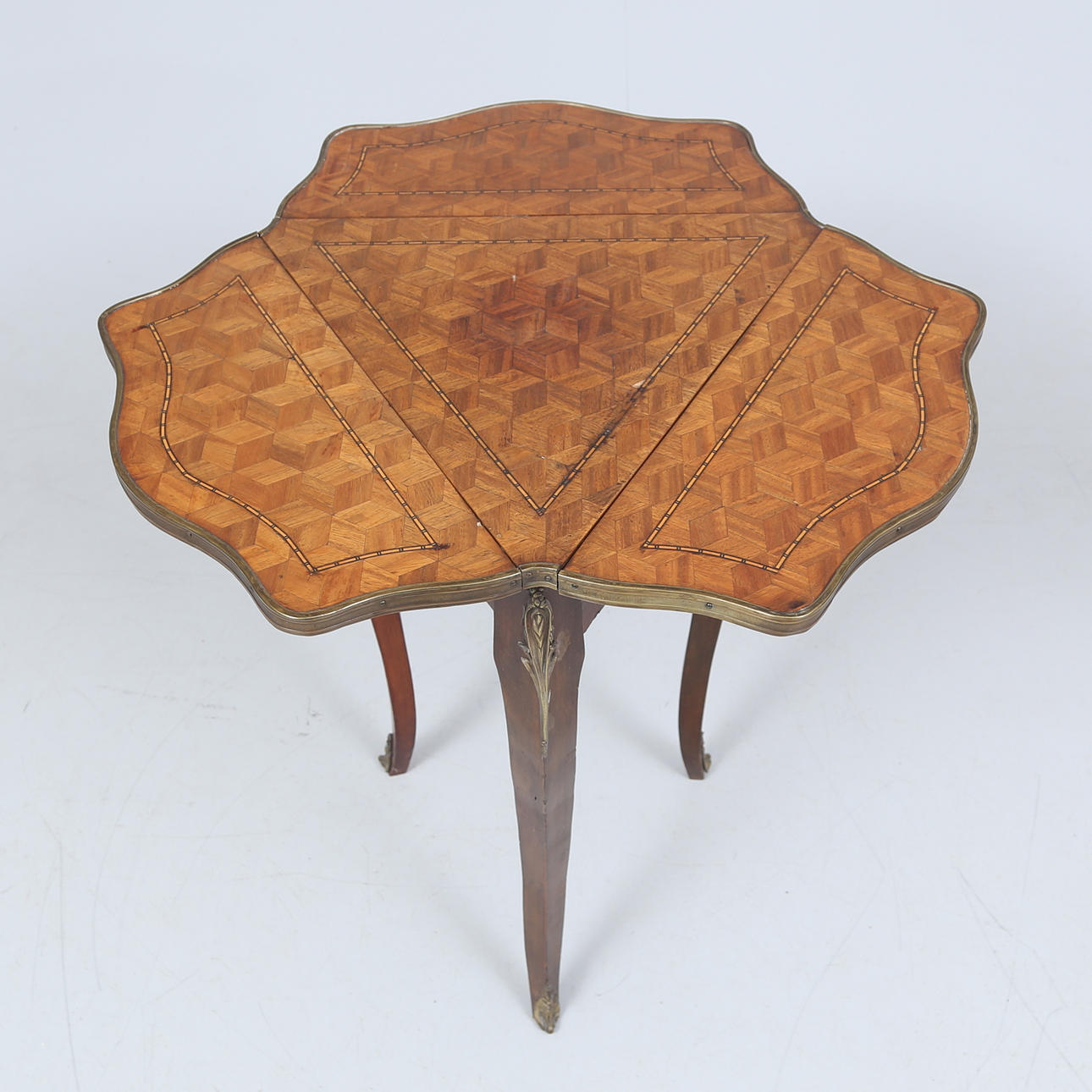 A Louis XVI style table with flaps, 20th century.