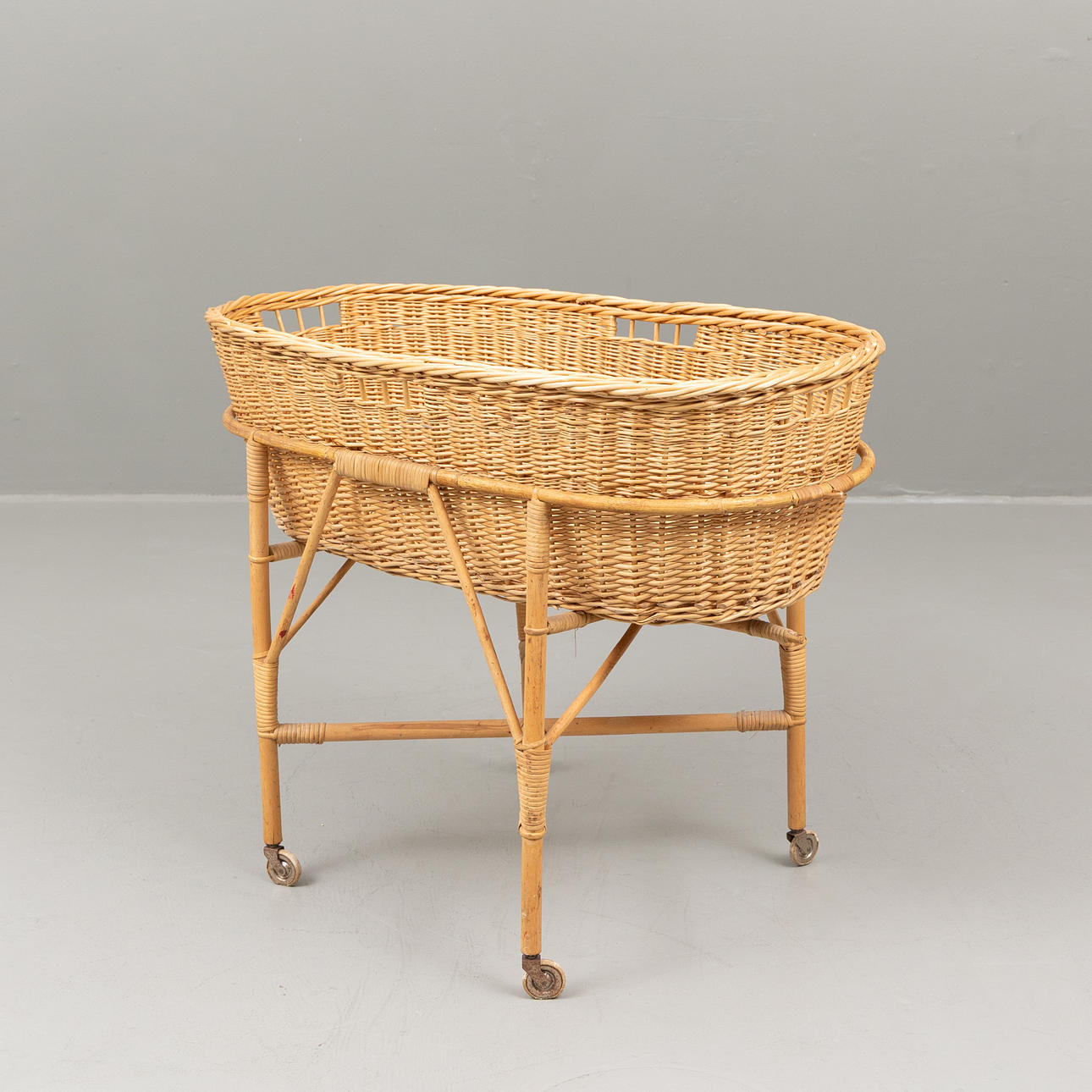 A wicker basket with base, mid 20th century.