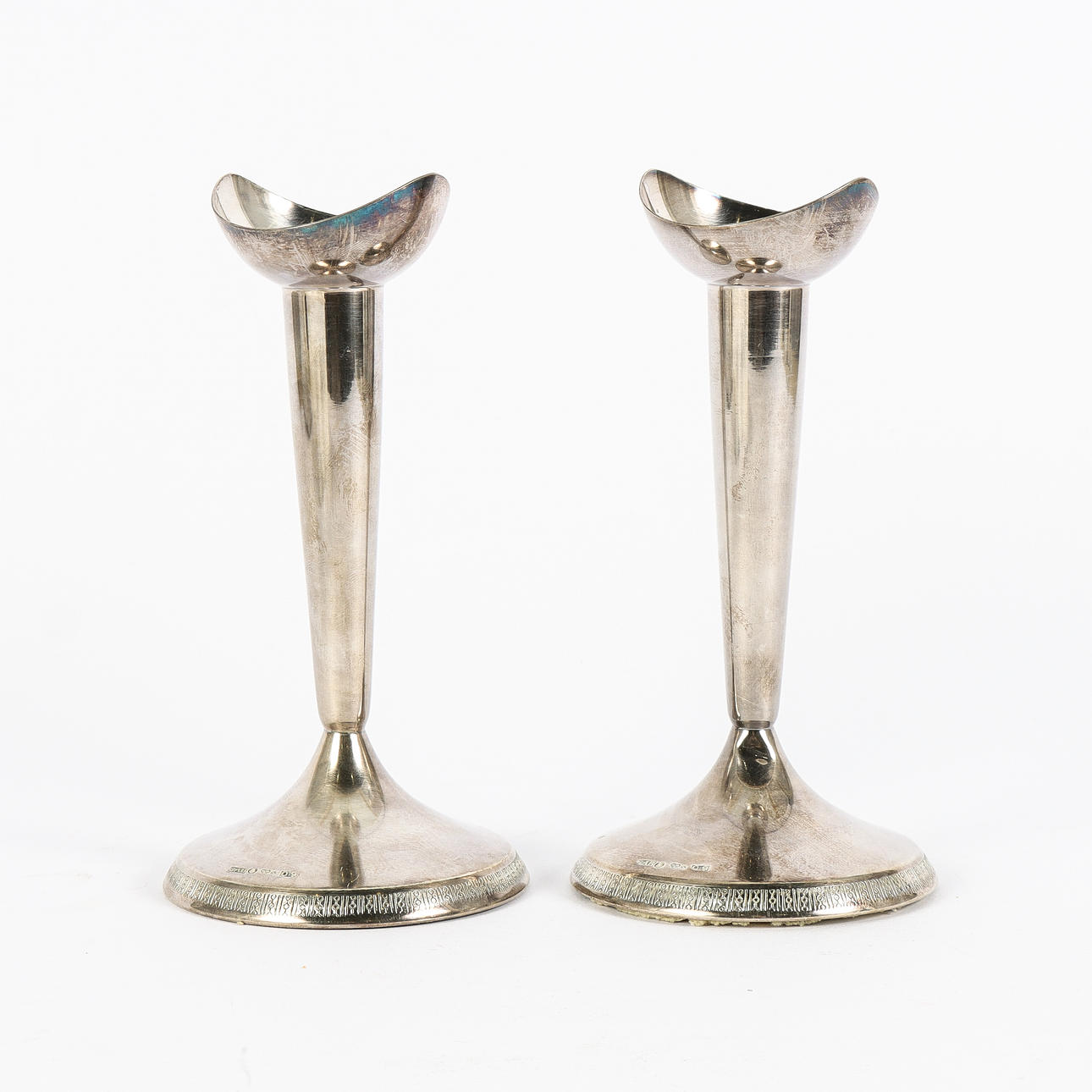A pair of silver candlesticks, GAB.