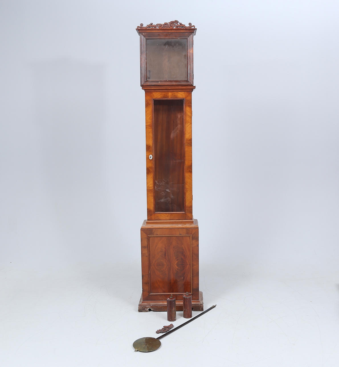 A mahogany floor clock case, 19th century.