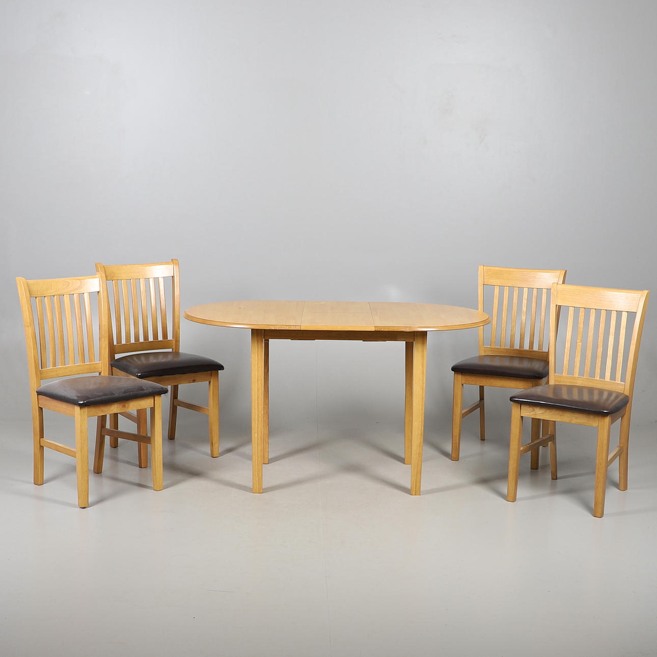 A MODERN TABLE AND CHAIRS.