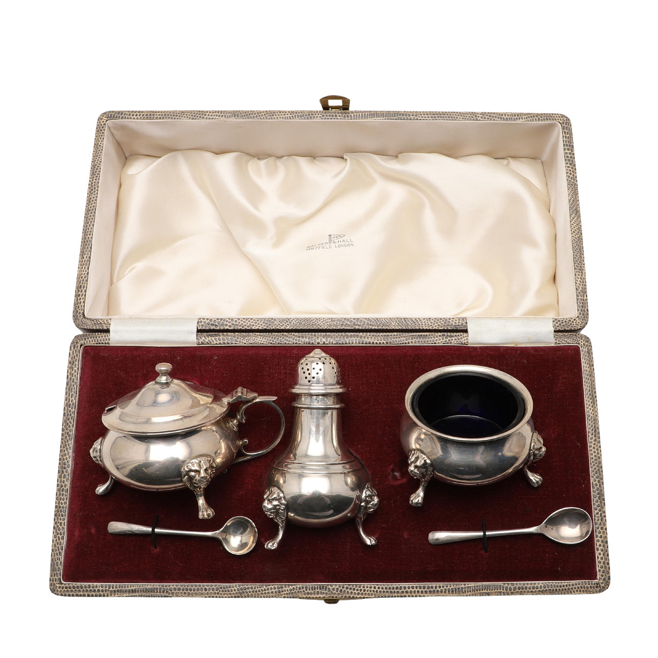 AN ELIZABETH II CASED THREE-PIECE SILVER CONDIMENT SET.
