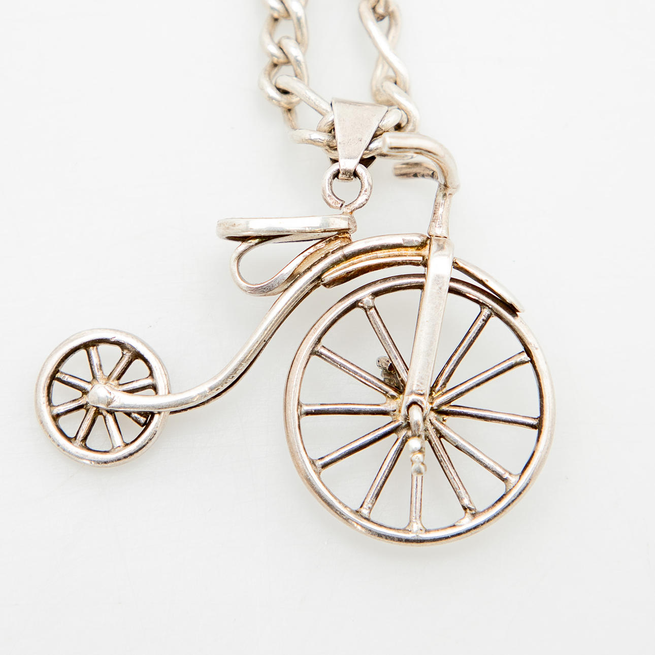 Sterling silver cuff shaped pendant with chain.