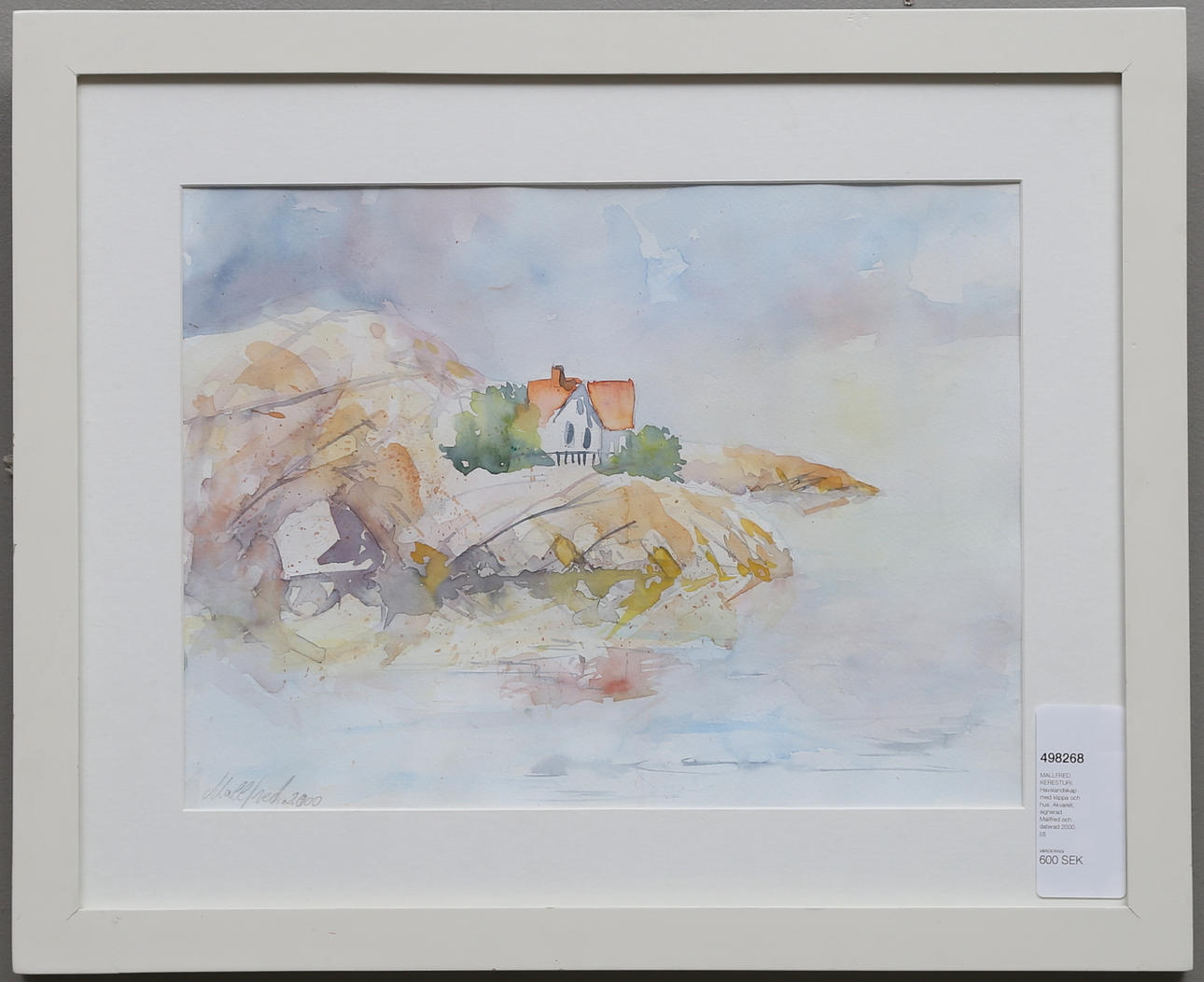 MALLFRED KERESTURI. Havslandskap med klippa och hus. Akvarell, signerad Mallfred och daterad 2000.