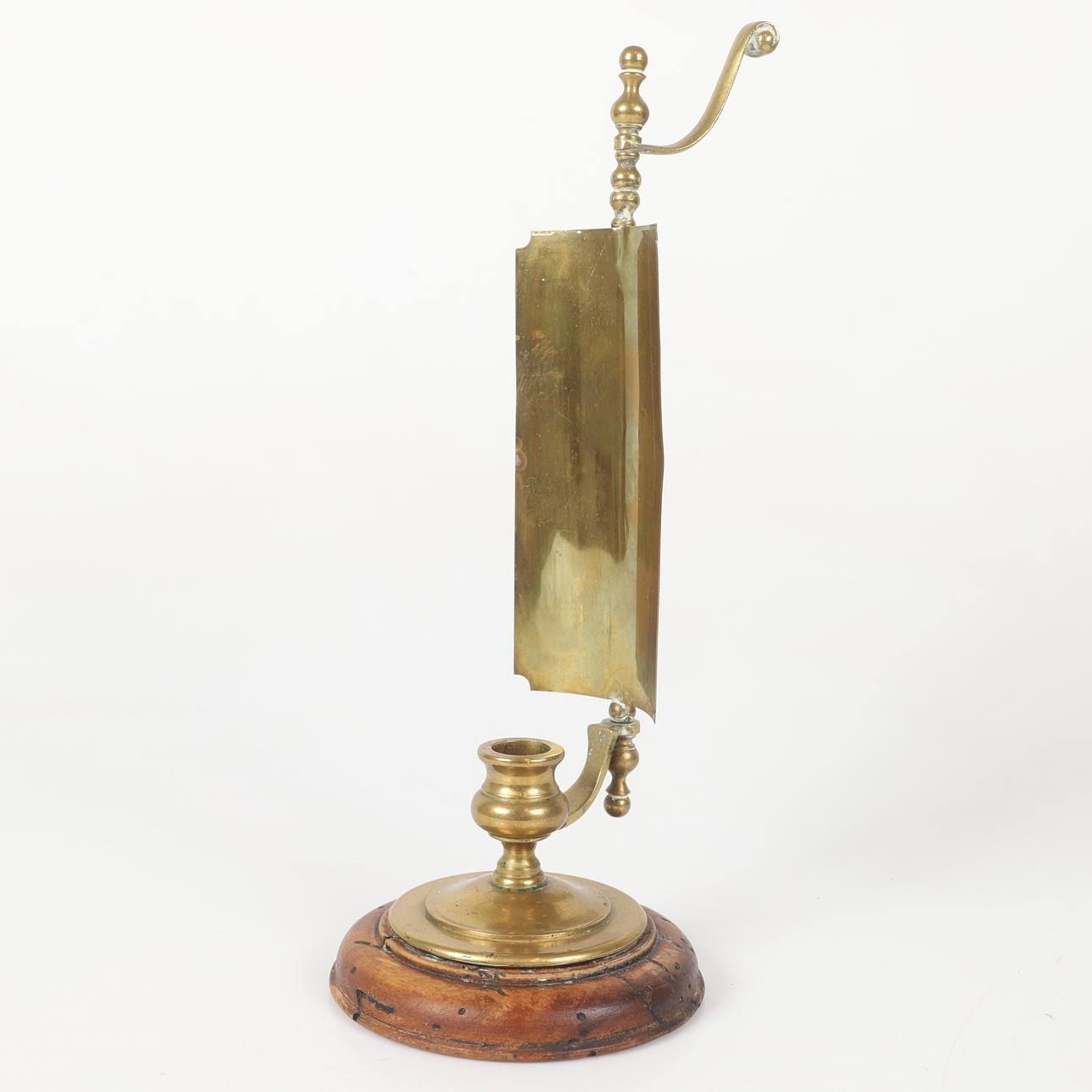 A candlestick, brass/wood, 20th century.