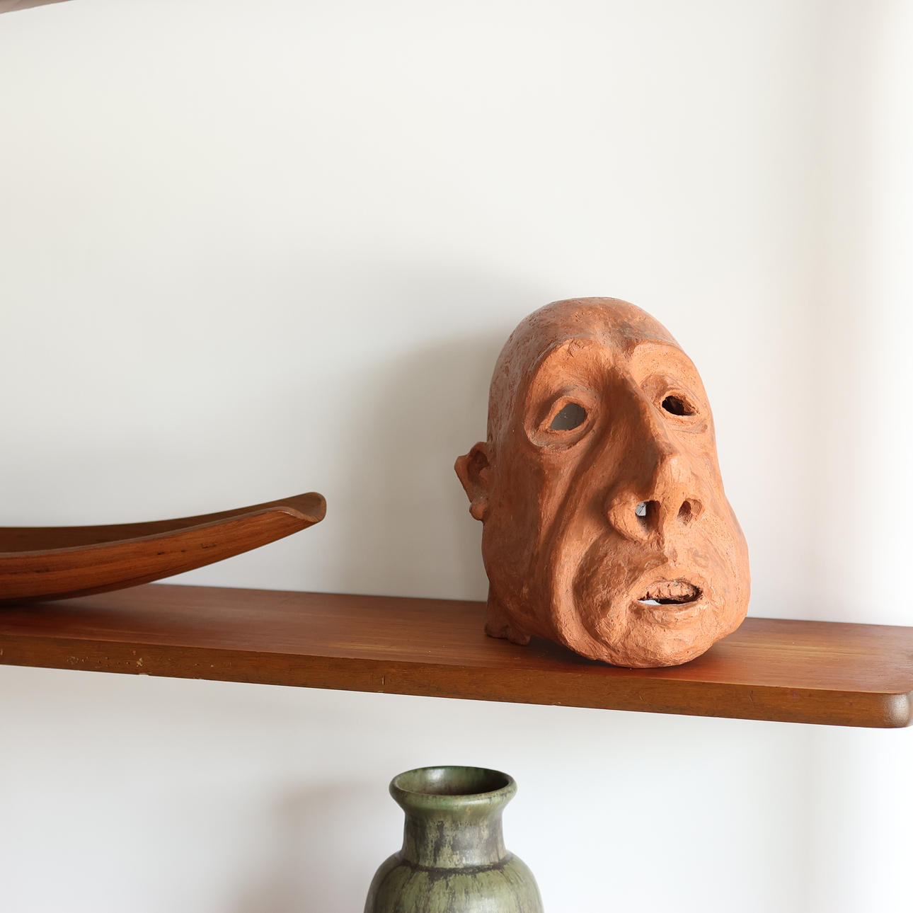 Earthenware mask depicting a man's head, 1900s.