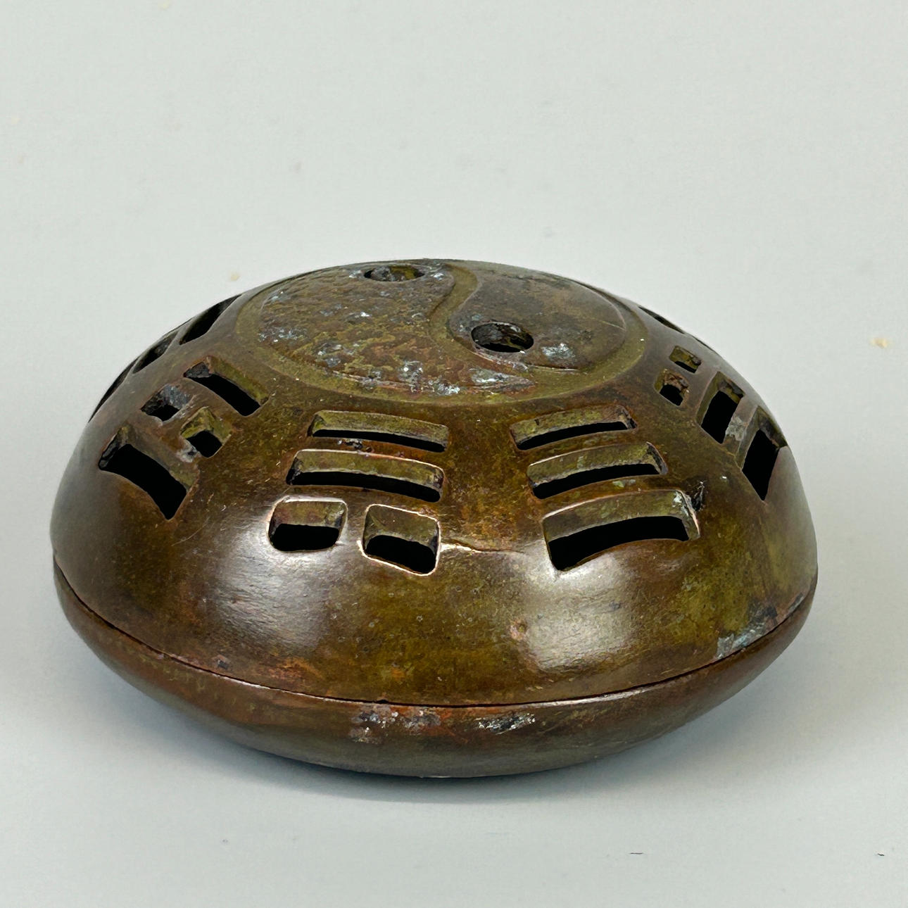 BRONZE PIERCED LIDDED CENSER.