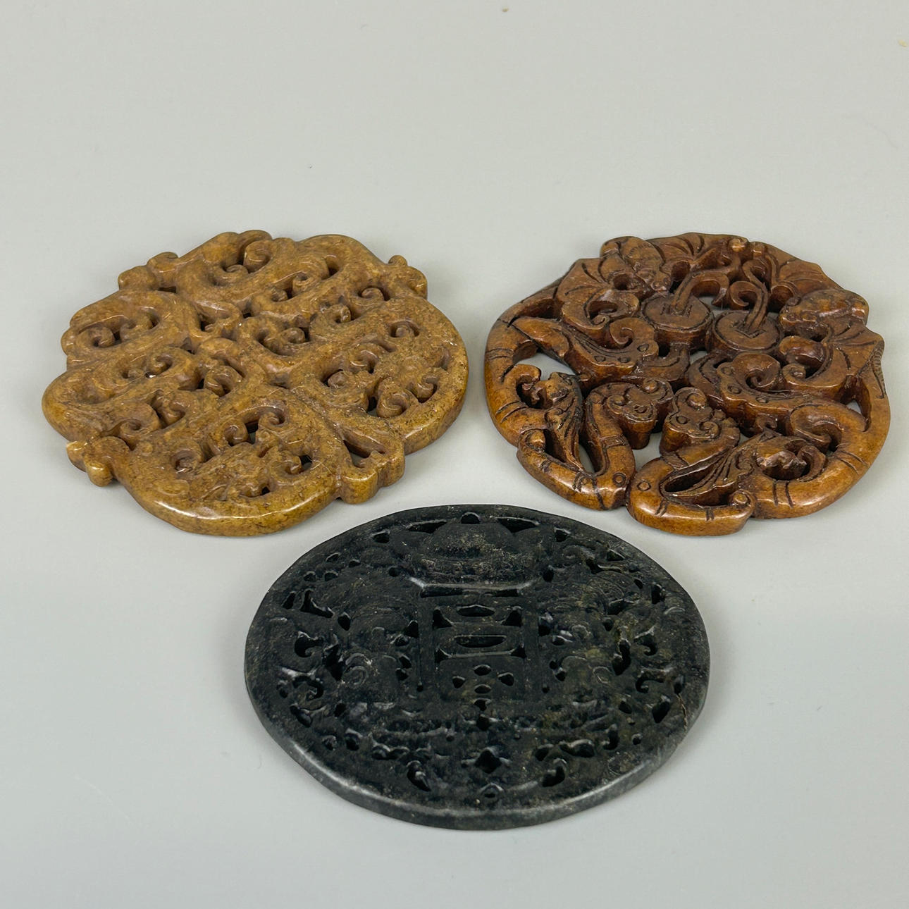 THREE CHINESE HARDSTONE ROUNDELS.