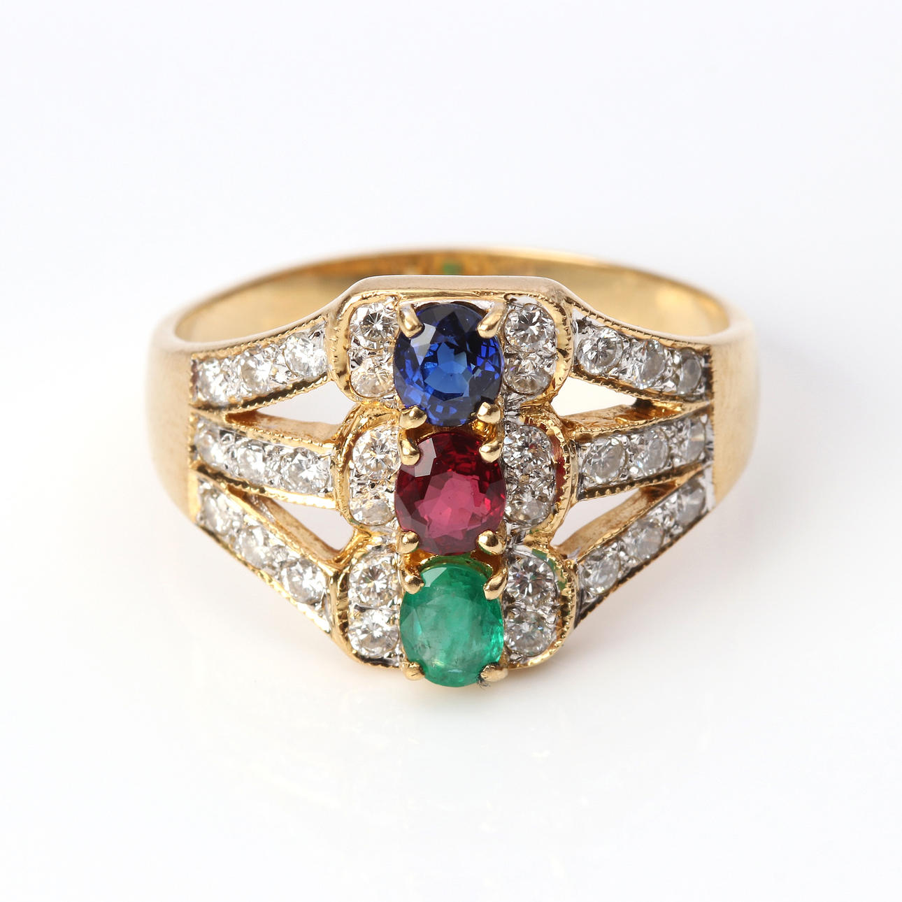 RING. Gold with sapphire, ruby and emerald with brilliant cut diamonds, total weight approx. 6.2 grams.