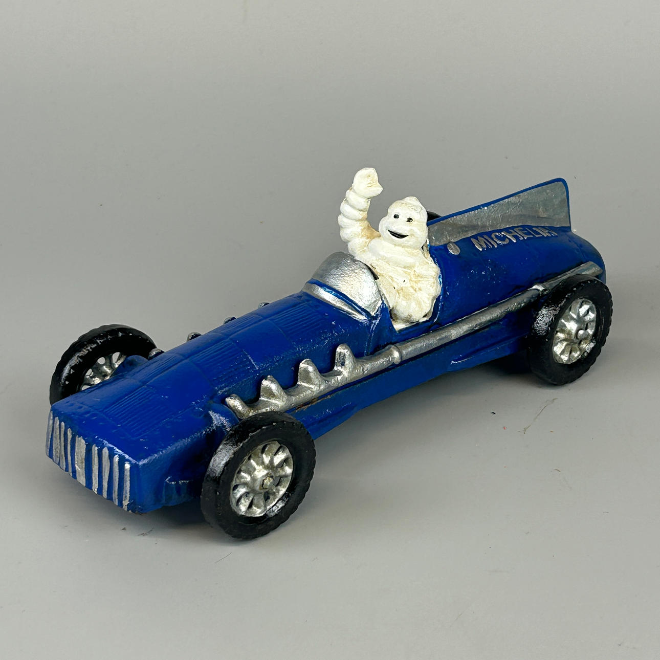 CAST IRON ADVERTISING FIGURE.