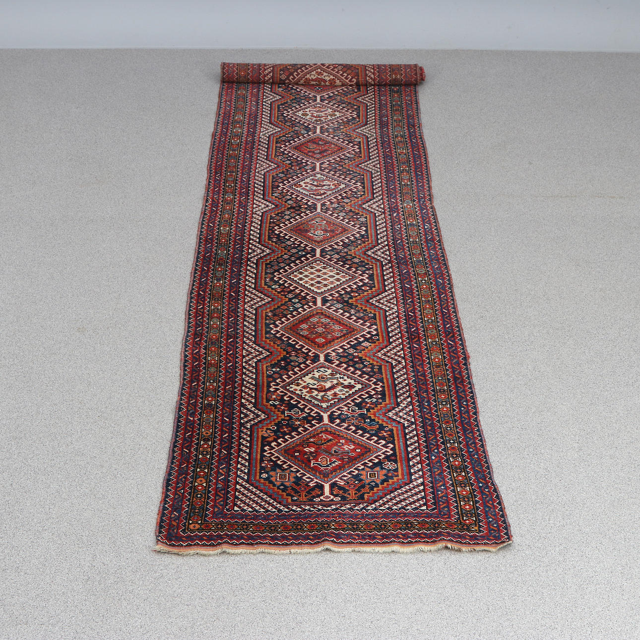 GALLERY MAT. Hand knotted, wool on woolen warp.