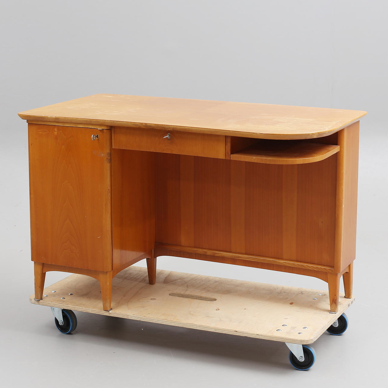 A freestanding desk with bookshelf, 1940s.