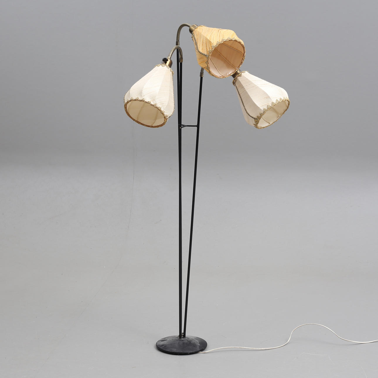 A 20th century three-armed floor lamp.