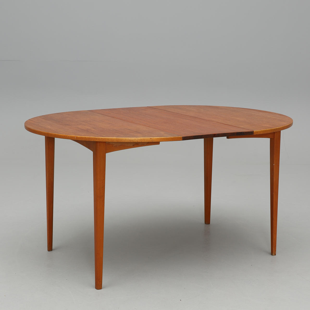 A mid-20th century dining table with insert top.