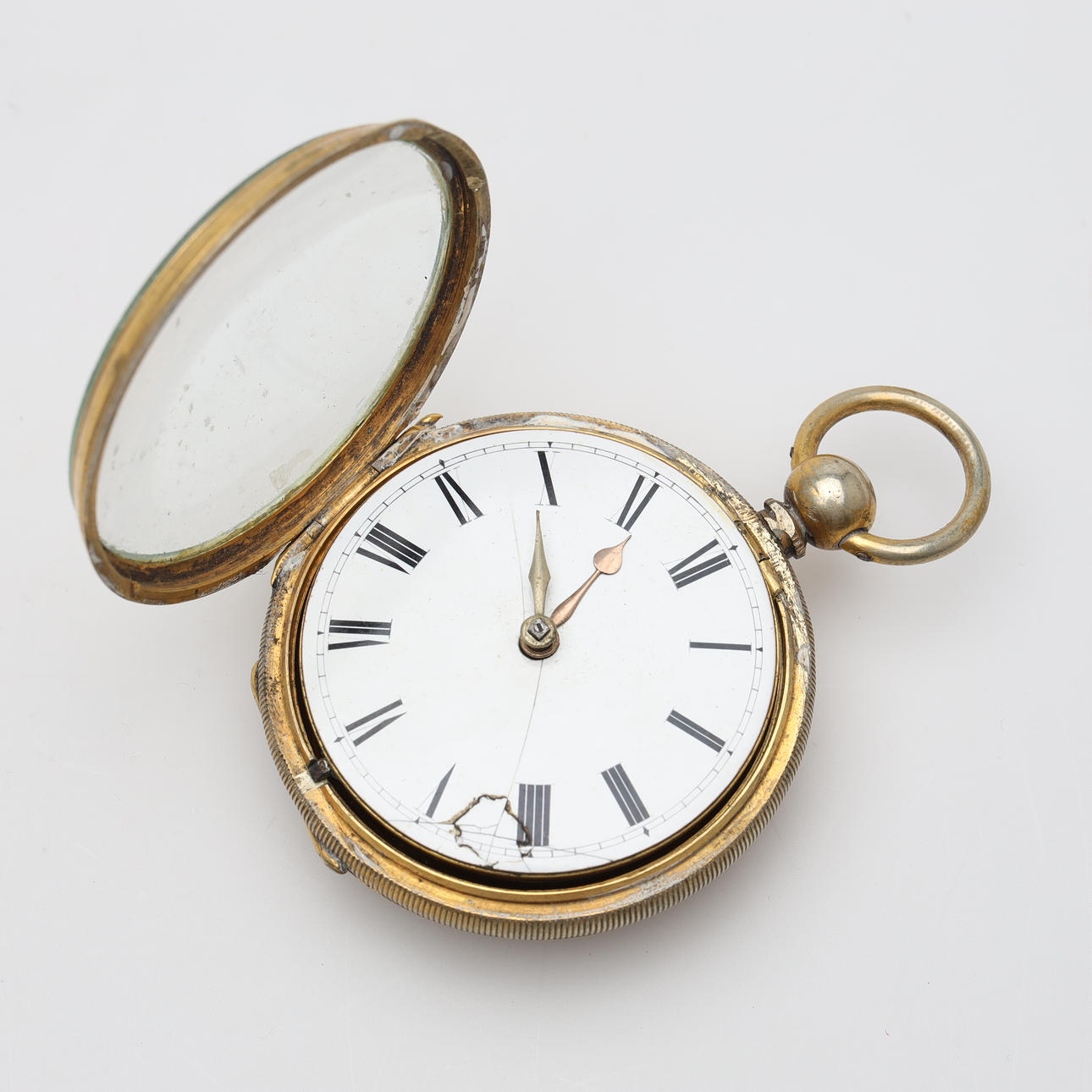 A metal spider clock, gold plated.