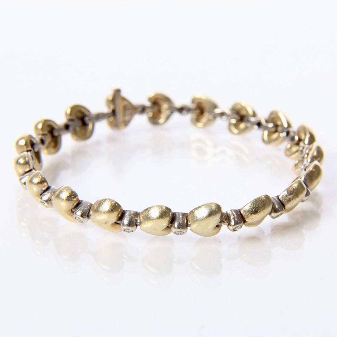 Gold bracelet with diamonds.