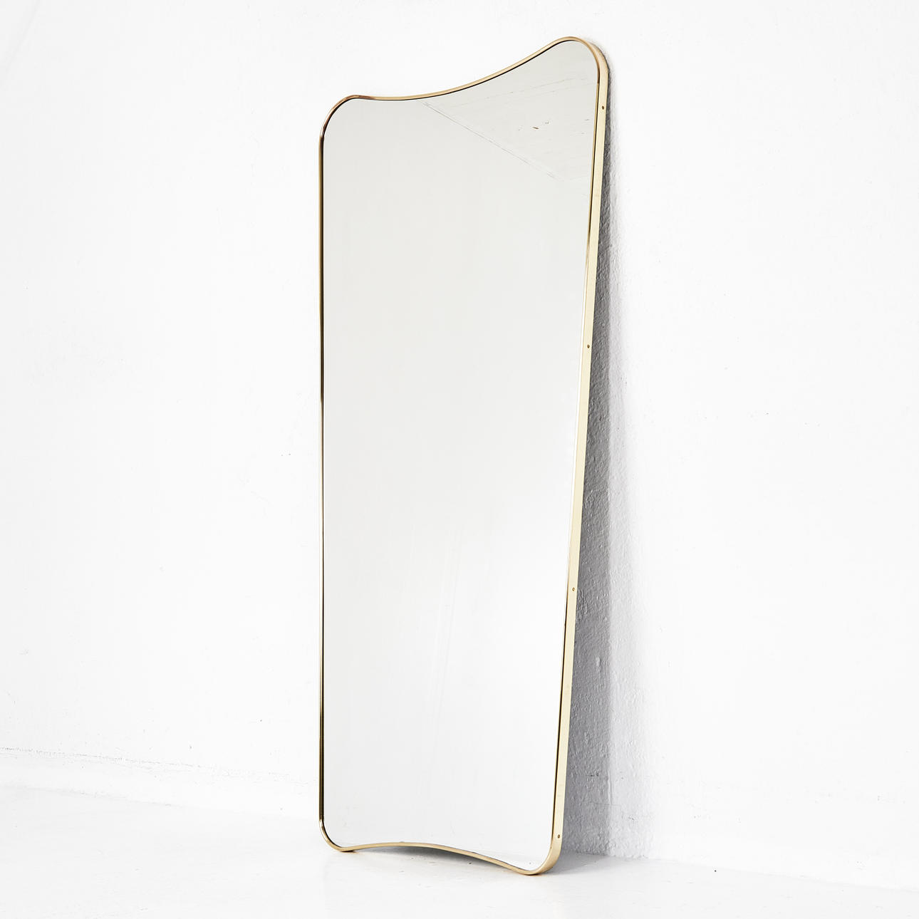 GIO PONTI. A “FA33” wall mirror, Gubi, frame in brass.