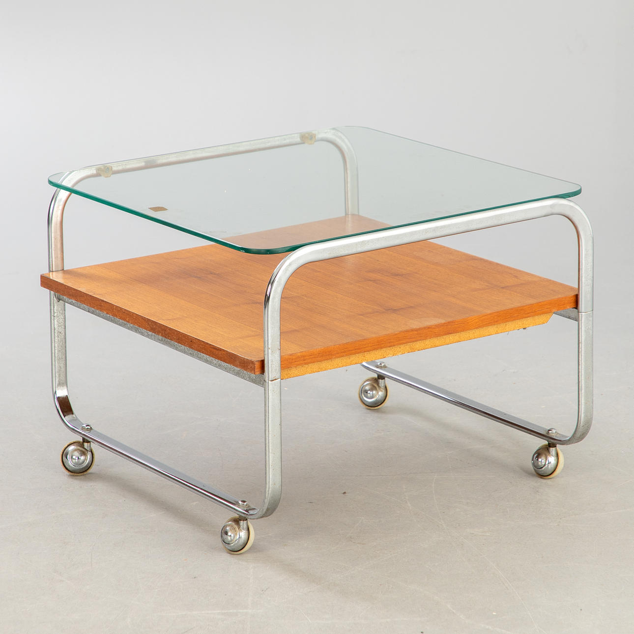 Rollable sofa table with glass top, Germany, 1960-1970s.