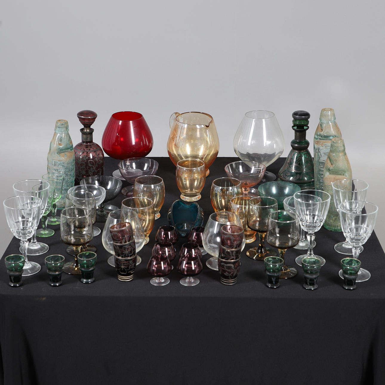 ASSORTED COLOURED GLASSWARE.