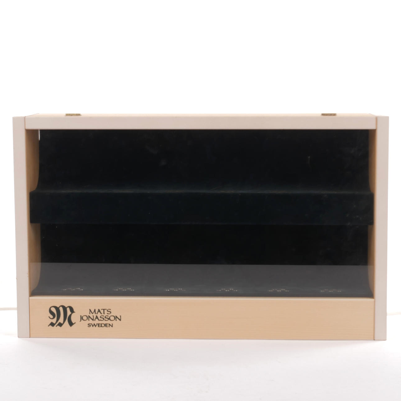 A “Mats Jonasson Målerås” cabinet.