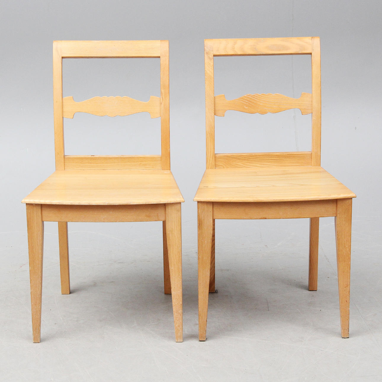 EVERT GENZELL. TWO STAMP SIGNED CHAIRS.