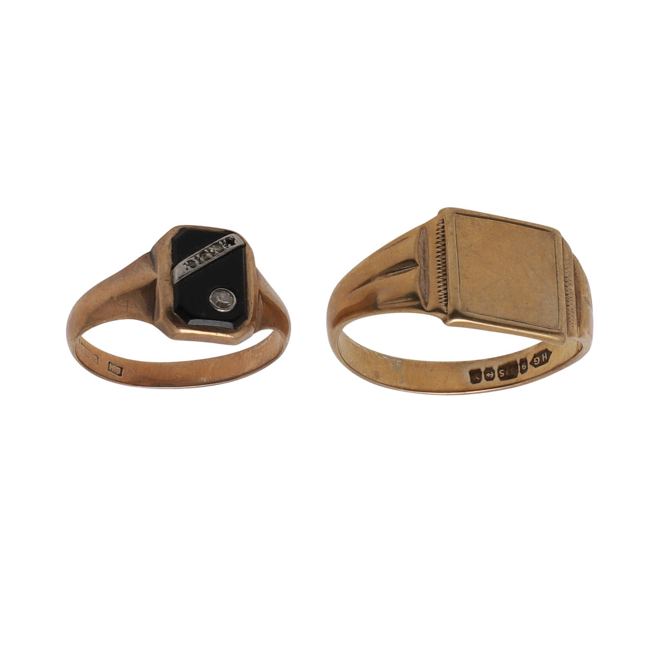 A BLACK ONYX AND DIAMOND SIGNET RING.