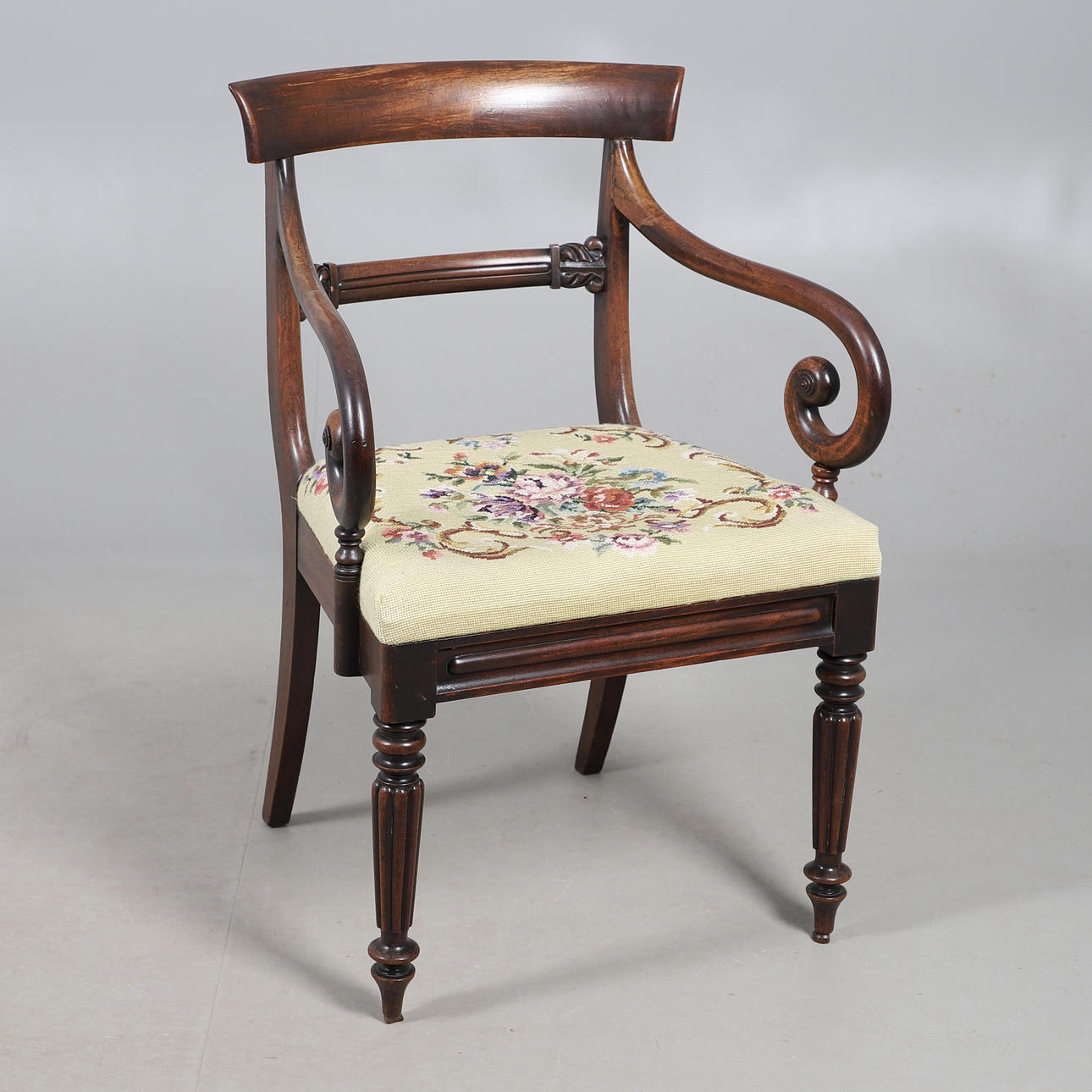 A WILLIAM IV SCROLL ARM LIBRARY CHAIR.