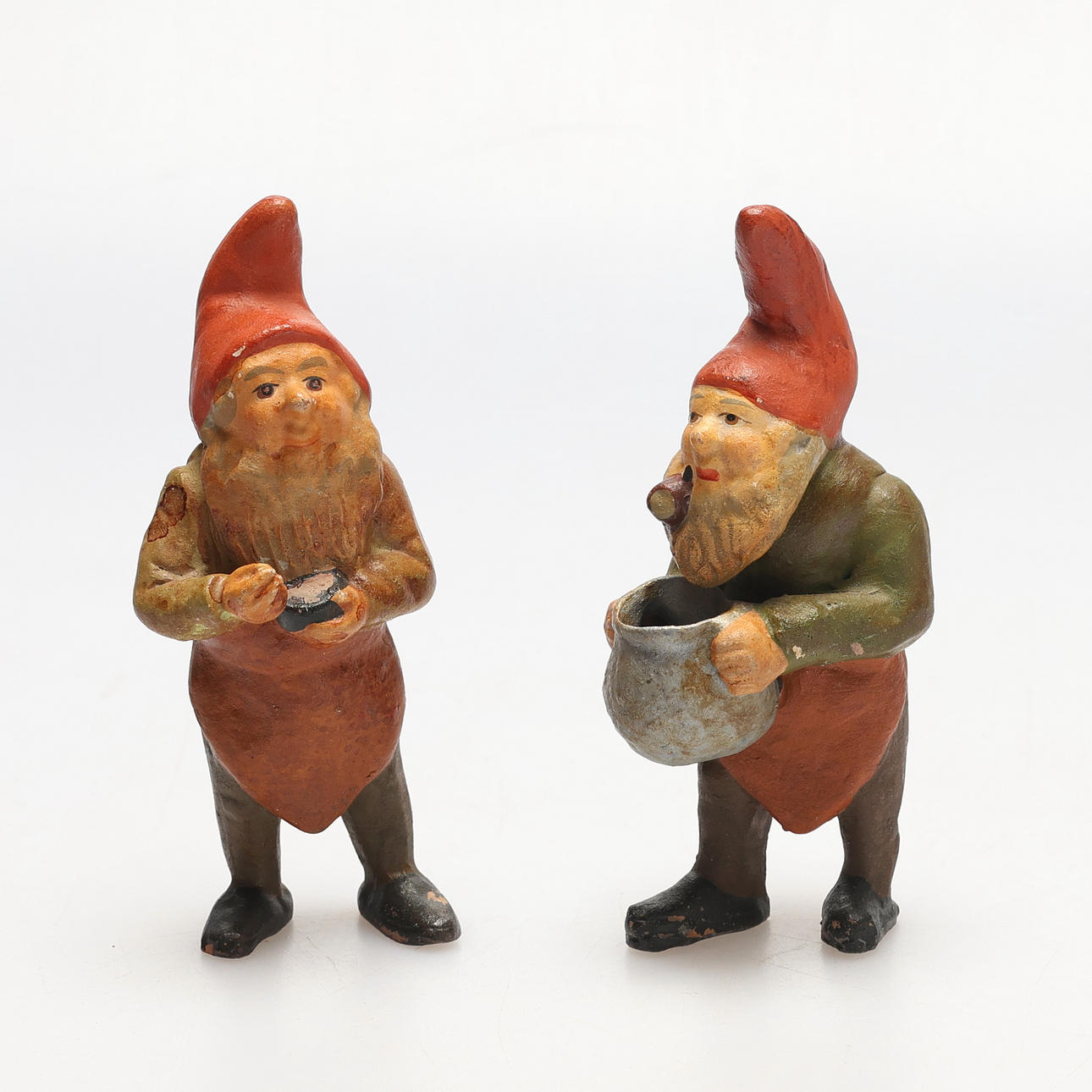 Two ceramic gnomes from 1800 to 1900.