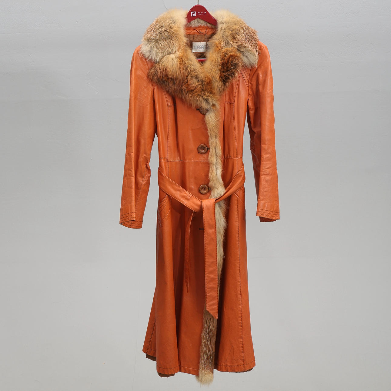 Leather coat, with fur collar red fabric.