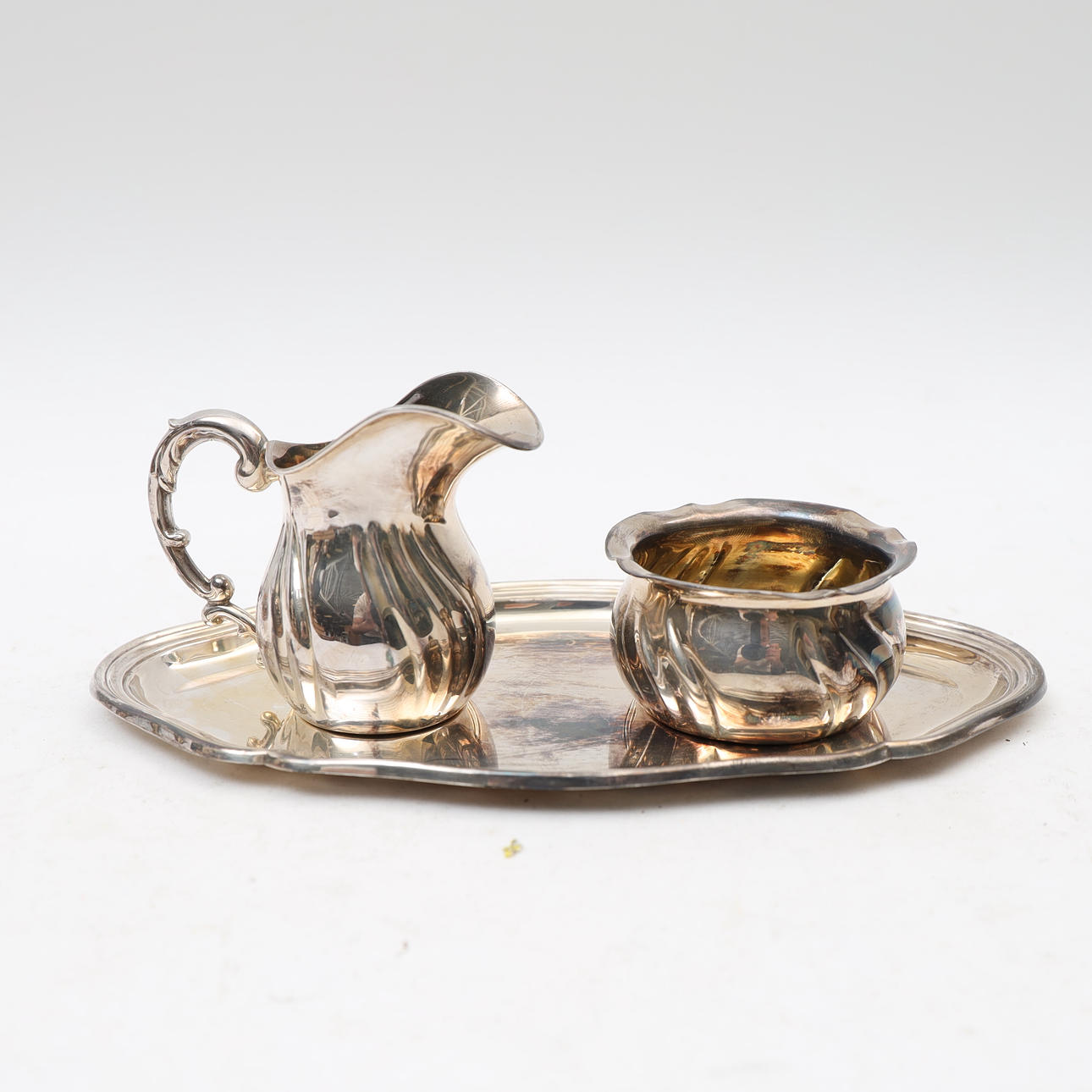 A silver serving set, 20th century, Rococo style.