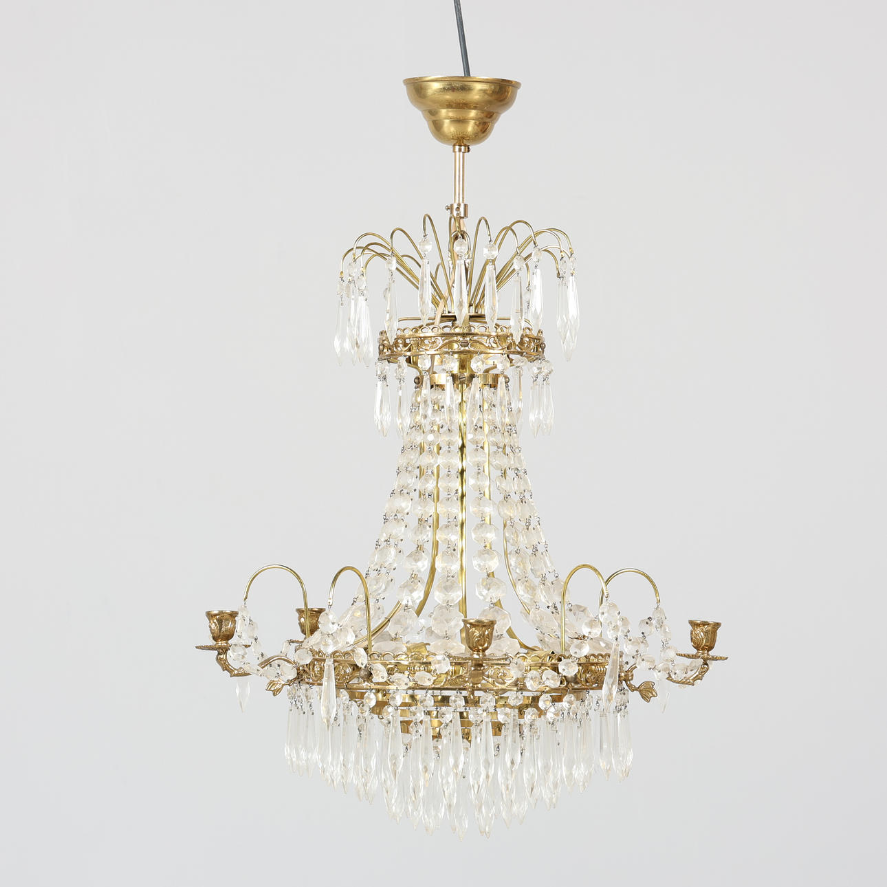 An empire-style chandelier, electrified.