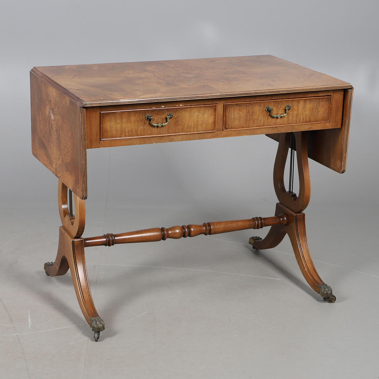 A REPRODUCTION SOFA TABLE.