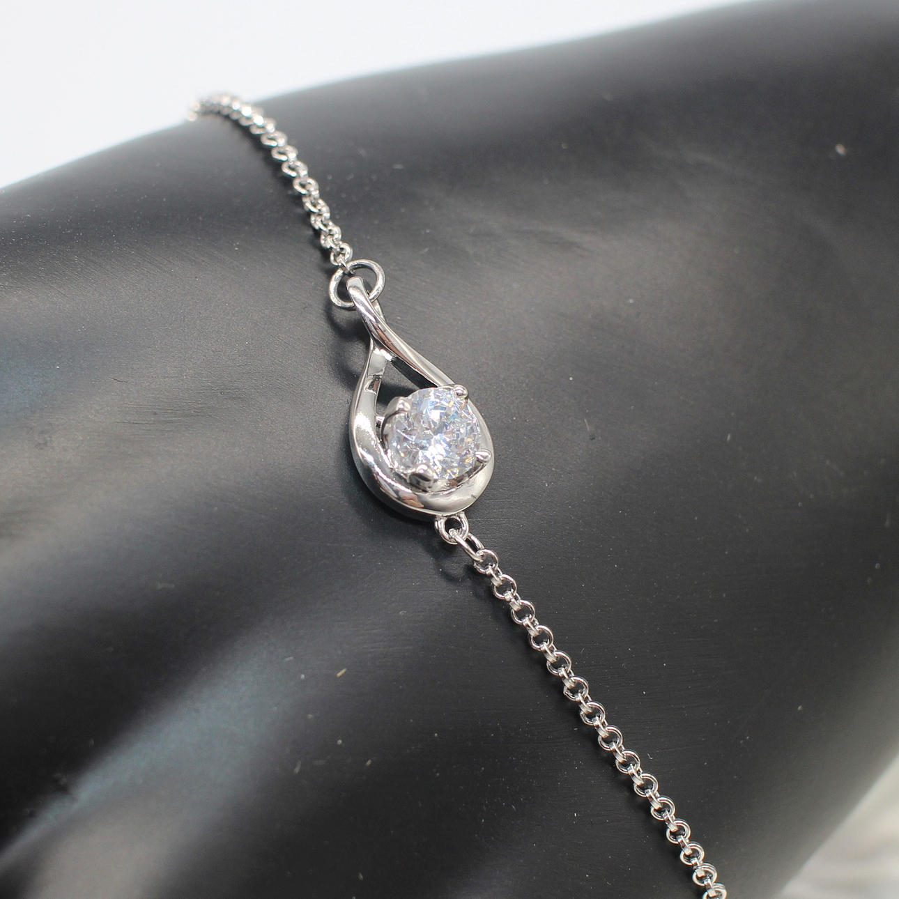 SILVER & CZ SOLITAIRE BRACELET.
