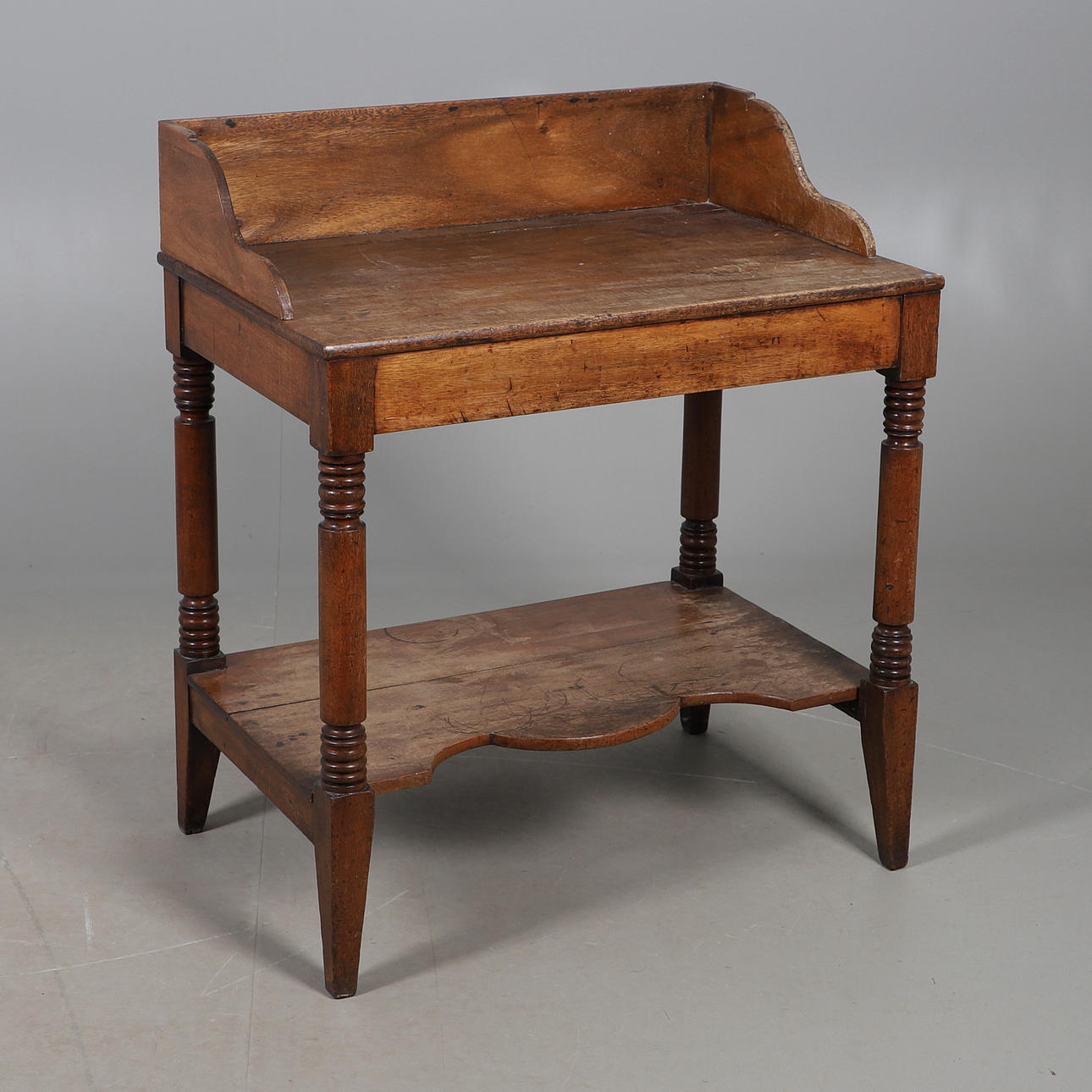 A MAHOGANY TWO TIER WASH STAND.