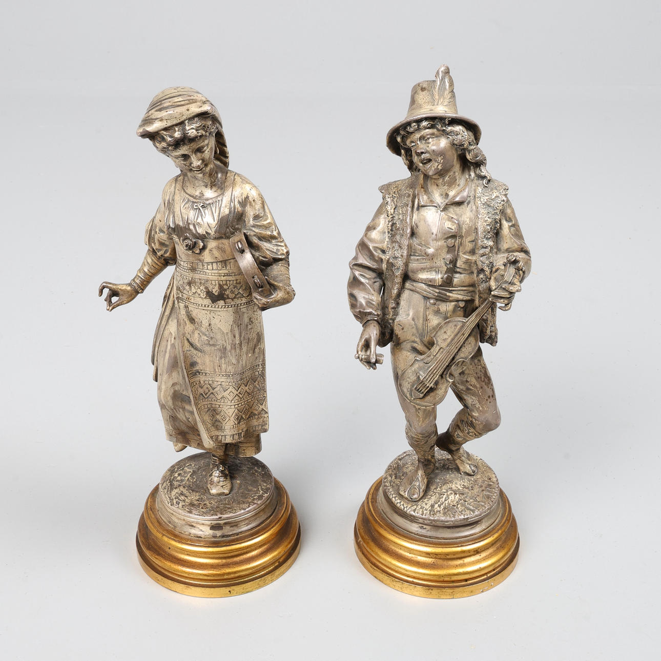 A PAIR OF SILVERED BRONZE FIGURES.