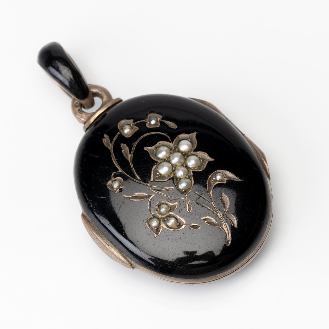 PENDANT with hide, enamel, silver.