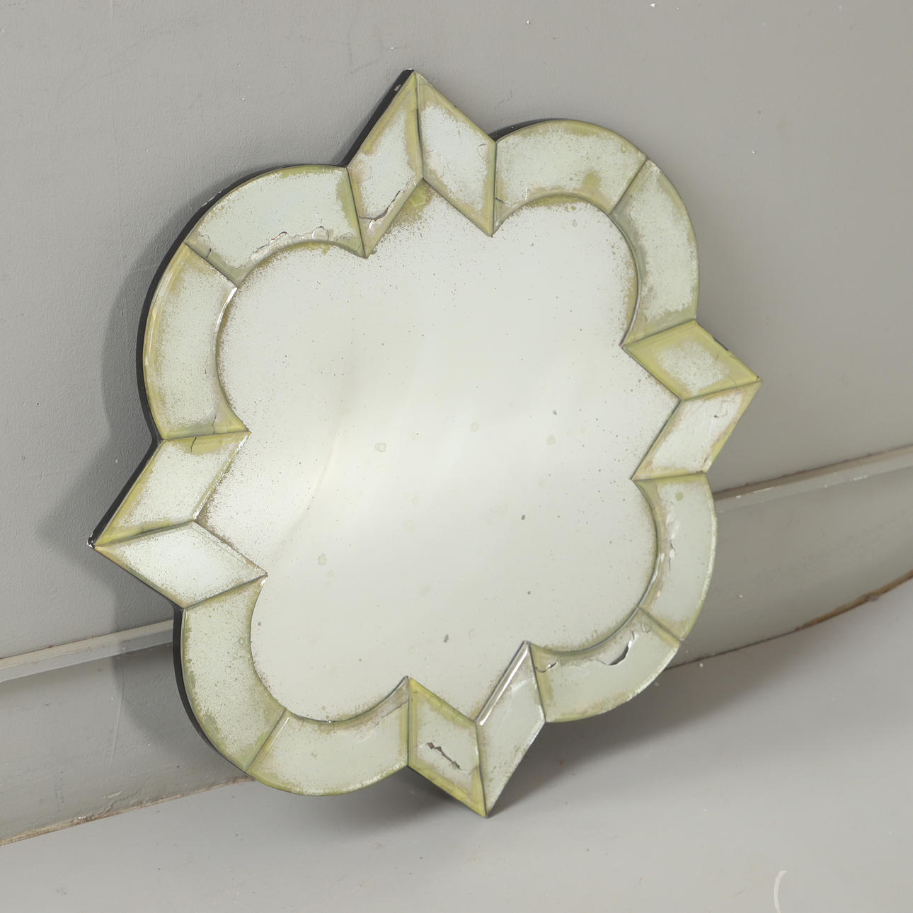 A mirror, faceted glass, contemporary.