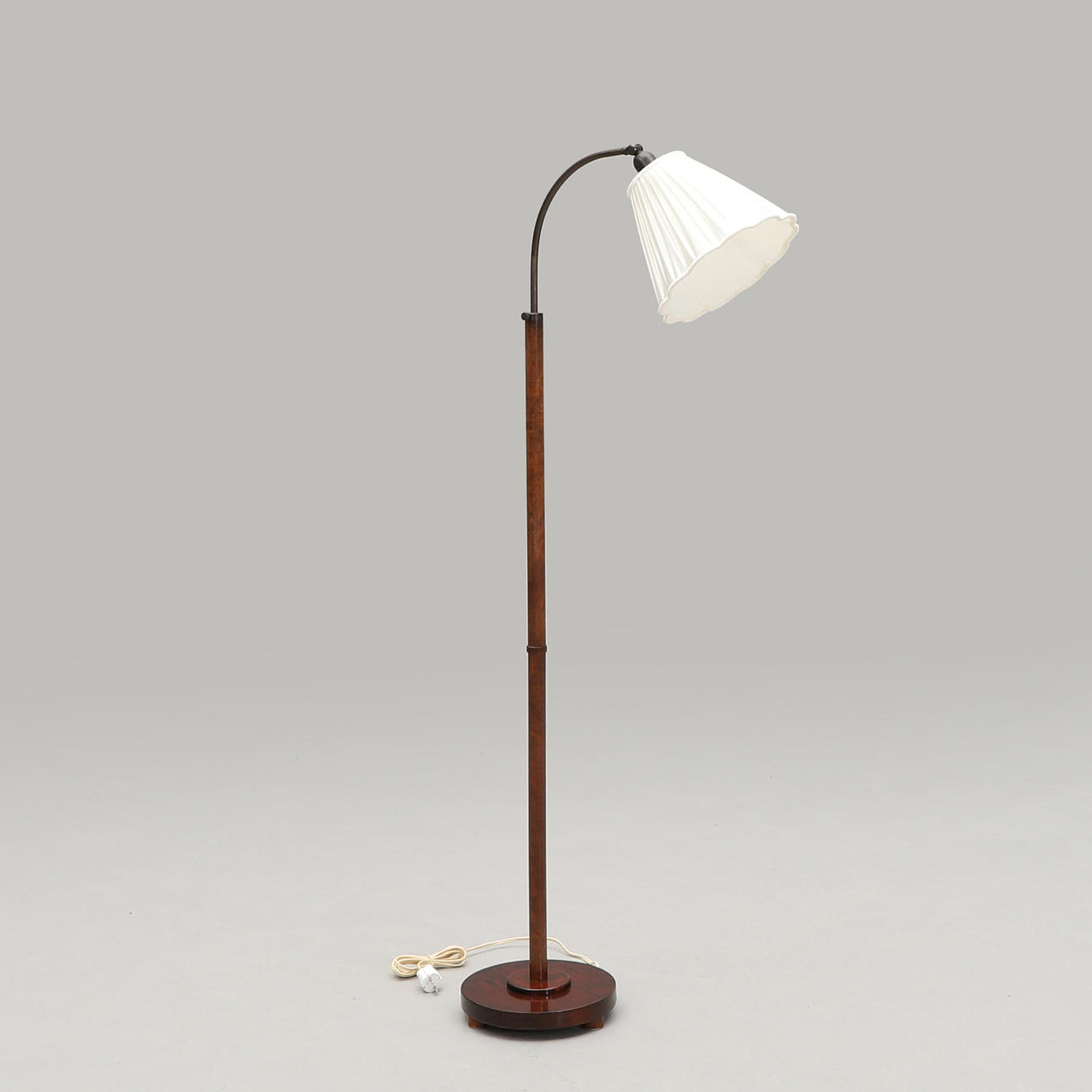A 20th-century raised and dippable floor lamp.