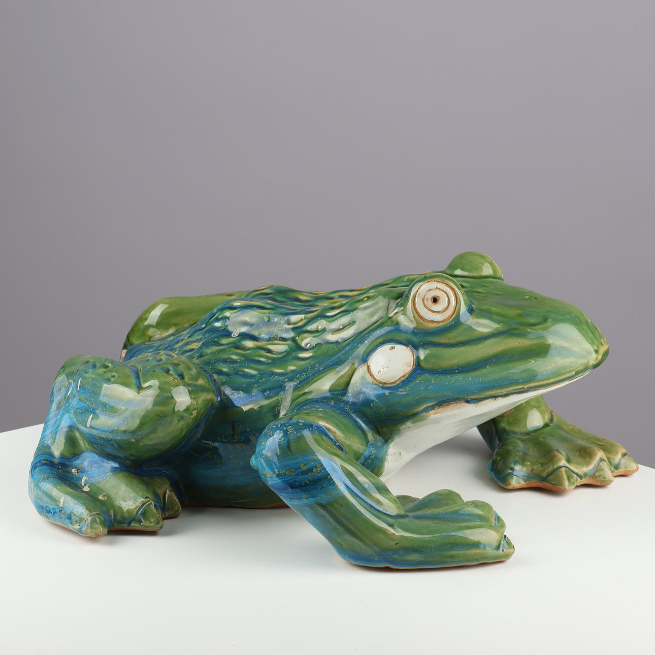 Ceramic seed sculpture of glazed earthenware.