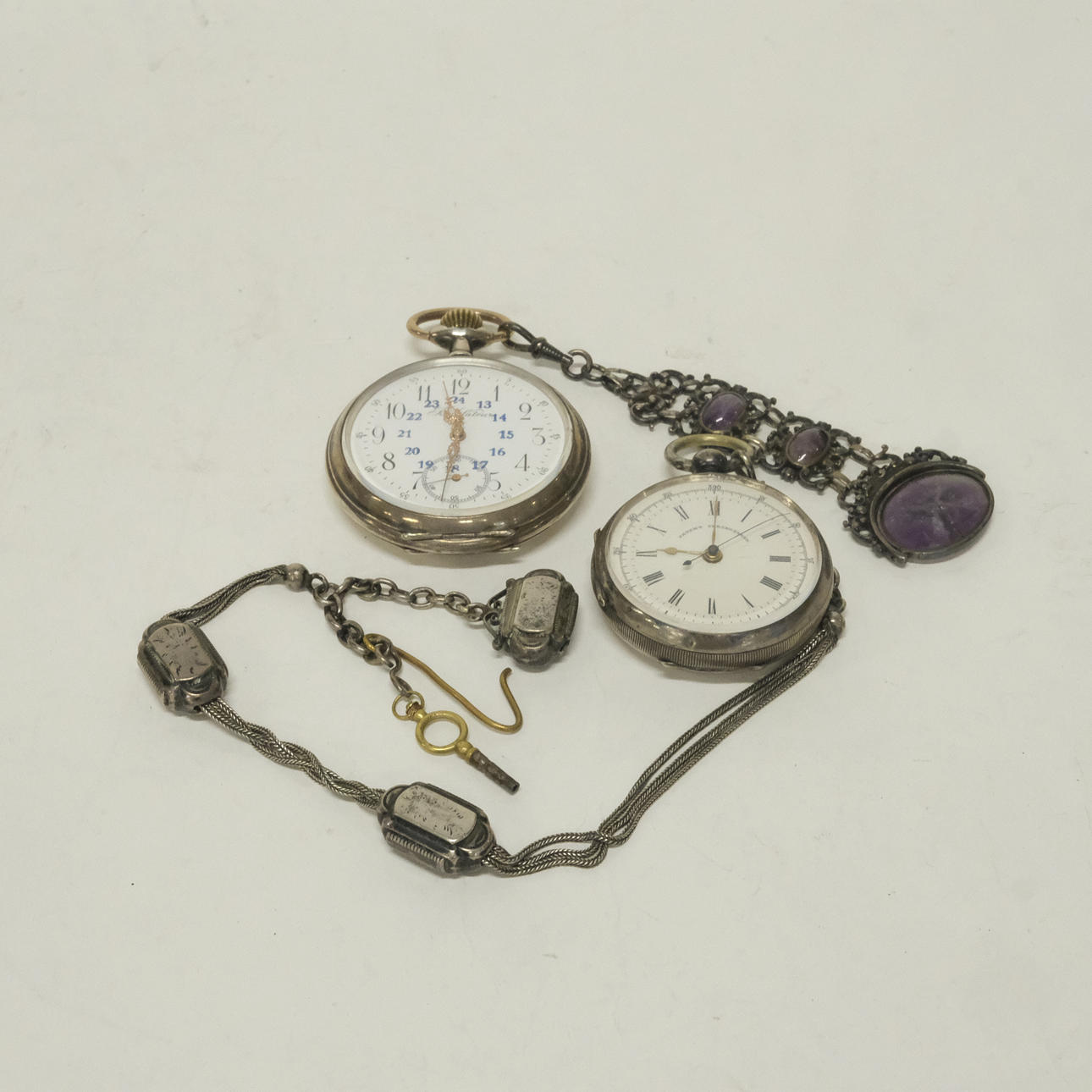 TWO POCKET WATCHES. SILVER CASES.