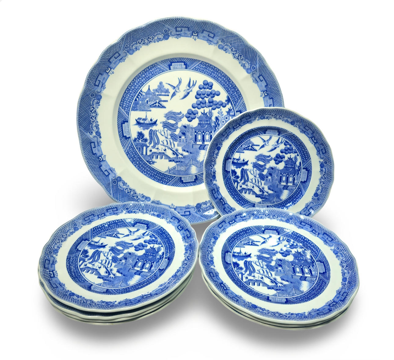 English earthenware dessert or tea set, Willovo pattern, with blue oriental landscape decoration. Serving platter and 9 plates.