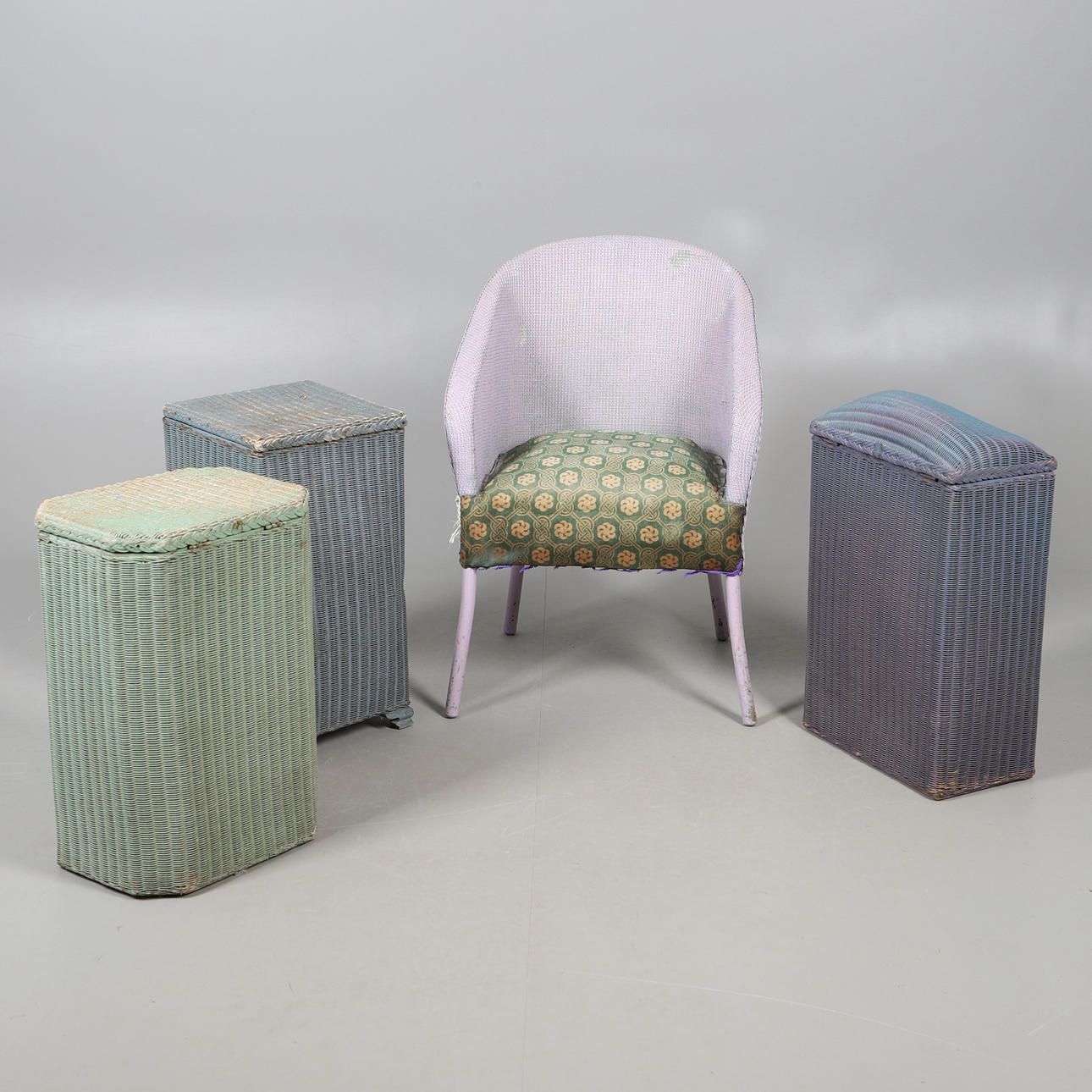 THREE RATTAN LAUNDRY BASKETS AND A CHAIR.