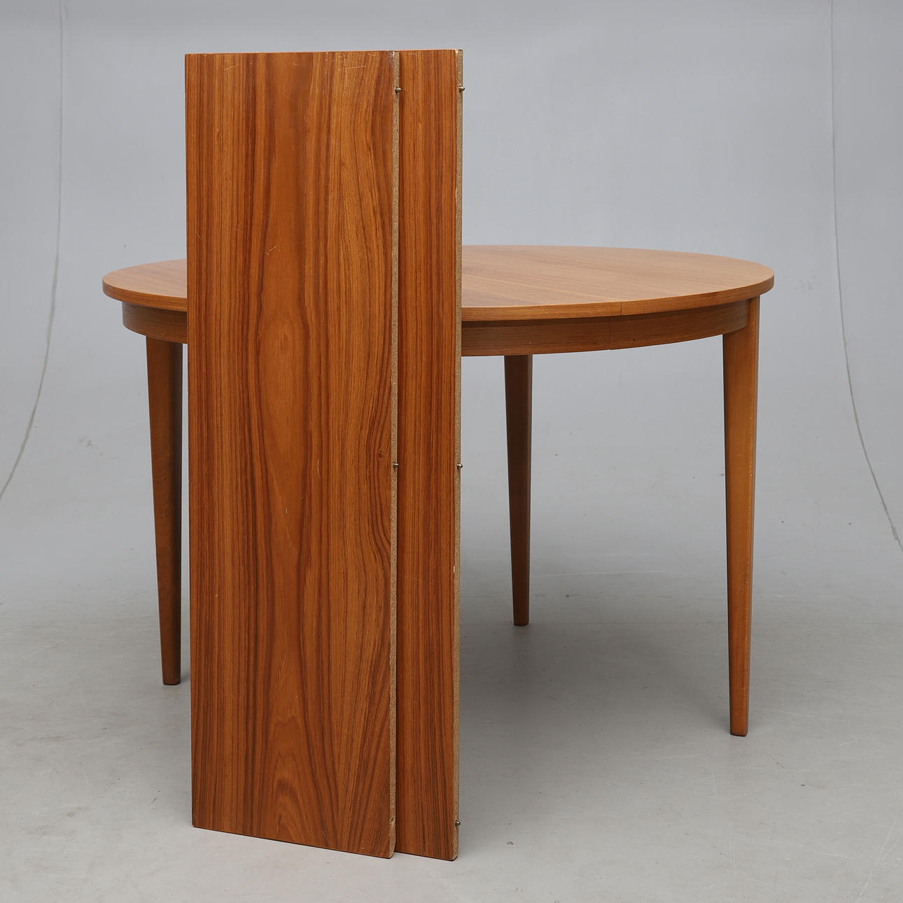 A teak dining table, 1950s/60s.