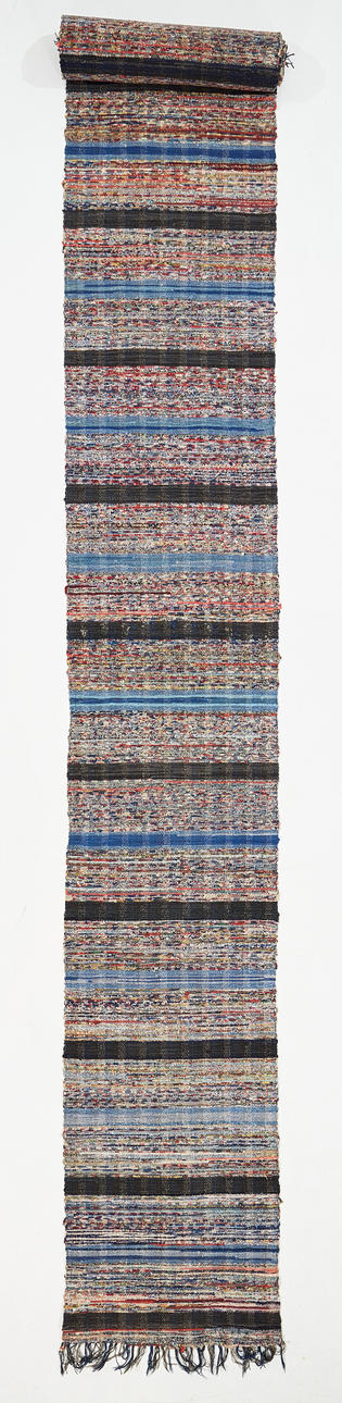 A cloth rug, 1940s, approx. 800x63 cm.